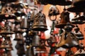 ceramic bells hanging at market for sale