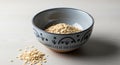 A ceramic bowl with decorative patterns contains a pile of rolled oats (Avena sativa), Royalty Free Stock Photo