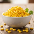Ceramic bowl filled with bright yellow corn kernels is placed on Royalty Free Stock Photo
