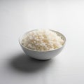 Ceramic bowl filled with cooked white rice is centered against Royalty Free Stock Photo