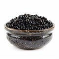 A ceramic bowl filled with shiny black olives, isolated on a white background. Royalty Free Stock Photo