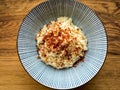 Ceramic bowl filled with steamed white rice and topped with chili sprinkles Royalty Free Stock Photo