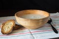 Ceramic bowl with mushroom soup puree with bread