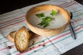 Ceramic bowl with mushroom soup puree with bread