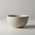 Ceramic bowl with a smooth, matte finish placed on a plain surface. The bowl has a Royalty Free Stock Photo