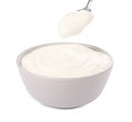 Ceramic bowl and spoon with delicious organic yogurt on white background