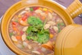 A ceramic bowl on a table with chinese soup Royalty Free Stock Photo