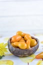 Ceramic bowl with yellow pear tomatoes on a light background Royalty Free Stock Photo