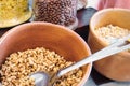 Ceramic bowls and glass jars with various breakfast cereals Royalty Free Stock Photo