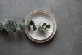 Ceramic bowls and plates on a dark background. Craft ceramic plates and bowls on a concrete table. Top view Royalty Free Stock Photo