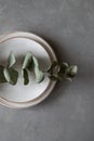 Ceramic bowls and plates on a dark background. Craft ceramic plates and bowls on a concrete table. Top view Royalty Free Stock Photo