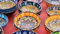 Ceramic bowls with traditional Turkish ornaments are sold at a street market