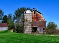 A Ceramic Brick Barn and a Cement Silo Royalty Free Stock Photo