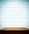 Ceramic brick tile wall and wooden table