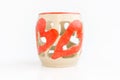 Ceramic candlestick with heart decor on white background. original pottery for valentines day.