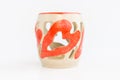 Ceramic candlestick with heart decor on white background. original pottery for valentines day.