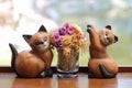 Ceramic cats on wooden table