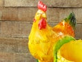 Ceramic chicken close up on wooden background