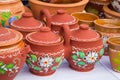 Ceramic clay handmade and handpainted decorative twin pots double pots with a handle and cover lids, jugs with floral and abstra