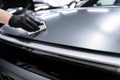 Ceramic coating application on matte car paint surface during professional car detailing process Royalty Free Stock Photo