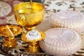 Ceramic cup and holy thread with holy water`s a buddhist in Gold tray and gold bowl for Thai engagement ceremony.Thai wedding