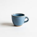 Ceramic cup with a round shape and a smooth handle. It is a light Royalty Free Stock Photo