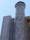 Ceramic decorated tower of a madrasah of Khiva in Uzbekistan.