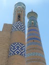 Ceramic decorated towers of a religious building of Khiva in Uzbekistan.