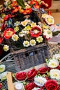 Ceramic decorative flowers in wicker basket