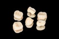 Ceramic dental crowns and veneers. Isolate on a black background close-up. Dental laboratory Royalty Free Stock Photo