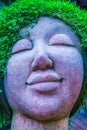Ceramic doll with grass on head