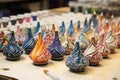 ceramic dreidels in various stages of painting