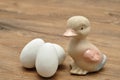 A ceramic duck with white easter eggs Royalty Free Stock Photo