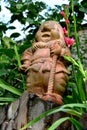 Ceramic dwarf. Green leave in the garden, in springtime Royalty Free Stock Photo