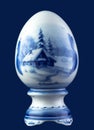 Ceramic egg isolated on blue