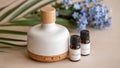 Ceramic Essential Oil Diffuser with Aromatherapy Bottles and Flowers Royalty Free Stock Photo