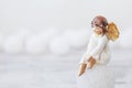 Ceramic figure of angel on light background. Copy spase Royalty Free Stock Photo