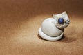 Ceramic figurine cute white cat with blue eyes. Royalty Free Stock Photo