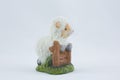 Ceramic figurine of an Easter lamb on a white background Royalty Free Stock Photo