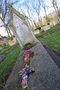 Ceramic floral tributes on grave