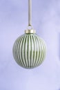 Ceramic Green Christmas Bauble on a light background. Royalty Free Stock Photo