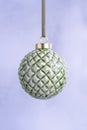 Ceramic Green Christmas Bauble on a light background. Royalty Free Stock Photo