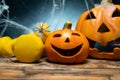 Halloween composition with ceramic Jack Lantern pumpkins and gym dumbbells. Royalty Free Stock Photo