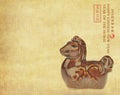 Ceramic horse souvenir on old paper Royalty Free Stock Photo