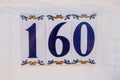 Ceramic house number one hundred and sixty. Royalty Free Stock Photo