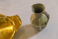 Ceramic jar and golden plate for baptism