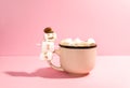 Ceramic mug with hot fresh cocoa drink and melted handmade marshmallow snowman Royalty Free Stock Photo