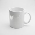 Ceramic mug with a simple, cylindrical shape and a smooth, glossy Royalty Free Stock Photo