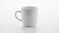 Ceramic mug with a smooth finish sits on a flat light colored Royalty Free Stock Photo