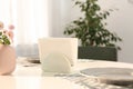 Ceramic napkin holder with paper serviettes Royalty Free Stock Photo